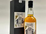 an image of a bottle of whisky next to a black box