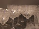 a lot of wine glasses sitting on a table