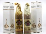 three bottles of wine sitting next to each other on a white surface