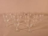 several empty wine glasses are lined up on a table