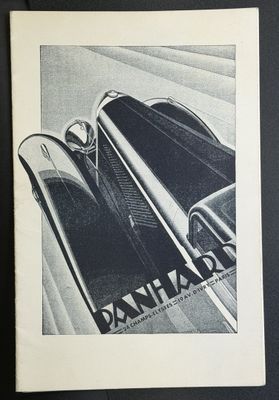 une vieille photo en noir et blanc d'une voiture sur laquelle on peut lire « Dan Harbas »
