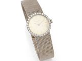 a lady ' s wrist watch with a diamond set bezel