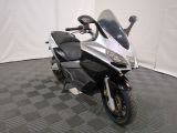 a picture of a motorcycle that is parked on a checkered floor