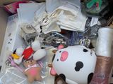 a box full of stuff that includes a stuffed animal and other items