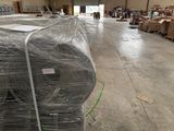 many rolls of wire wrapped around a pallet in a warehouse