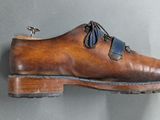 a shoe that is hanging on the wall