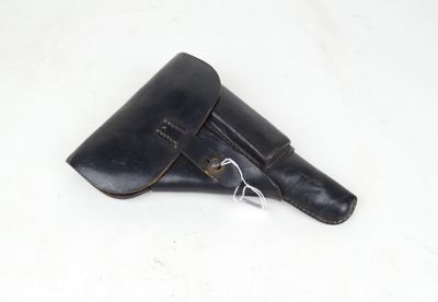 an image of a black leather holster on a white surface