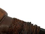 a close up of a wooden handle with a rope around it