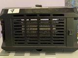 a black radio sitting on top of a white table