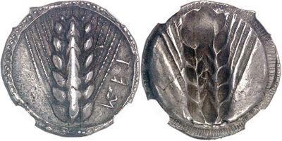 an image of a silver coin with a picture of a plant on it