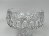 a glass bowl that is sitting on a table