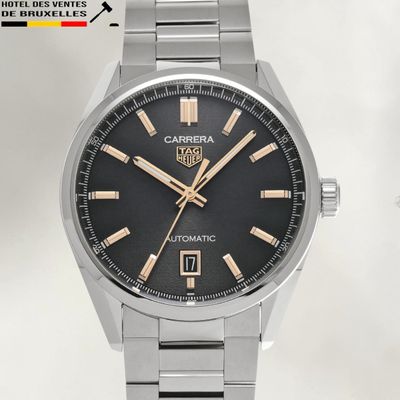 an image of a close up of a watch on a white surface