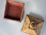 two small wooden boxes sitting next to each other on a table
