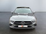 the front of a silver mercedes cla parked in a room