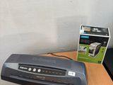 an image of a desk with a computer and printer on it