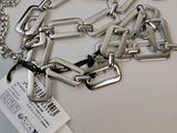 a silver chain with a tag attached to it