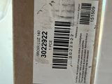 a box with a barcode on it sitting on a window sill