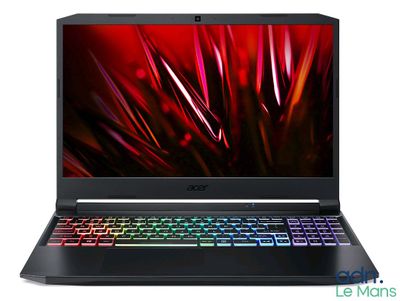 un ordinateur portable avec un clavier coloré et une souris posée dessus