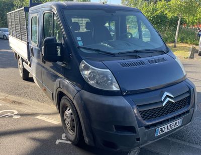 a black van that is parked on the side of the road