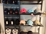many hats and hats on display in a store
