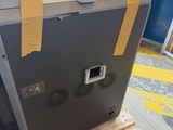 a refrigerator that is sitting on a pallet in a warehouse