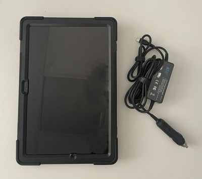 a tablet with a charger and a charger attached to it