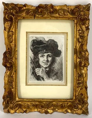 an old picture of a woman with a hat and a cigarette in a gold frame
