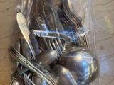a bag of silverware sitting on a table