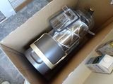 a box with a blender inside of it on the floor