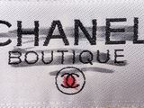 a close up of a chanel boutique label on a white background