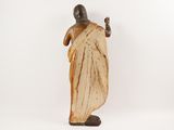 an image of a statue of a man in a sari
