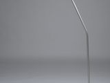 a white desk lamp with a black base on a gray surface