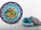 a blue plate with a picture of a castle on it