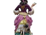 an image of a figurine of a woman with a dog
