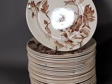 many plates stacked on top of each other on a table