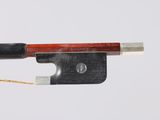 the bow is made of wood and has a black handle