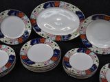 a lot of plates that are sitting on a table