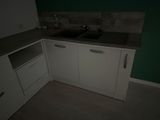 a kitchen with a sink and a dishwasher in it