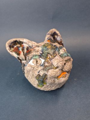a ceramic animal that is sitting on a table