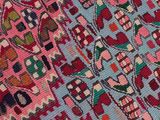 a close up of a colorful rug with many designs on it