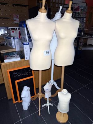 three mannequins on display in a store