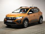 the orange car is parked in a large room with a checkered floor