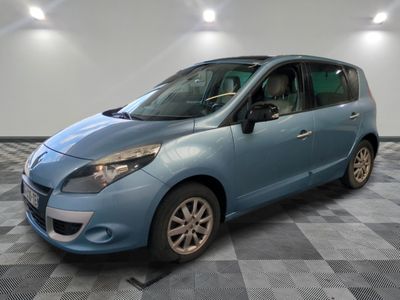 a picture of a blue car parked in a garage