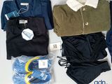 a lot of clothes that are sitting on a table