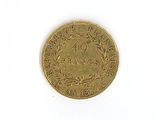 a close up of a coin on a white surface