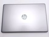 a silver laptop with a hp logo on the screen