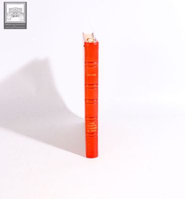 a red lighter that is sitting on a white surface