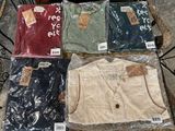 a lot of men ' s shirts on display on a table