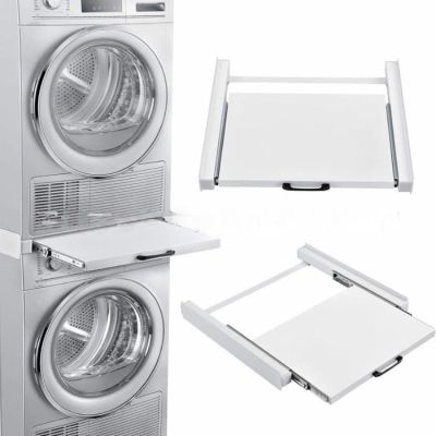 a white washer and dryer sitting next to each other on top of each other