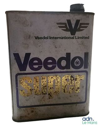 a can of weeddol super on a white background